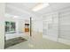 Finished basement with built-in shelving, fireplace, and sliding door access at 205 Bruton Dr, Chapel Hill, NC 27516