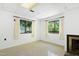 Basement features a fireplace and large windows with curtain coverings at 205 Bruton Dr, Chapel Hill, NC 27516
