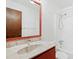 Bathroom features marble sink, wood cabinets, and shower over tub at 205 Bruton Dr, Chapel Hill, NC 27516