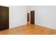 Bedroom features hardwood floors, white walls, and neutral color scheme at 205 Bruton Dr, Chapel Hill, NC 27516