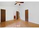 Bright bedroom features hardwood floors, neutral paint and ceiling fan at 205 Bruton Dr, Chapel Hill, NC 27516
