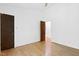 Bedroom features hardwood floors, a ceiling fan, and a large closet at 205 Bruton Dr, Chapel Hill, NC 27516