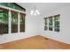 Sun-filled dining area boasting hardwood floors, large windows and modern light fixture at 205 Bruton Dr, Chapel Hill, NC 27516