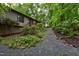 View of the home's exterior with well-maintained landscaping and a charming walkway at 205 Bruton Dr, Chapel Hill, NC 27516