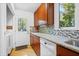 Kitchen with granite countertops, tile backsplash, and stainless steel dishwasher at 205 Bruton Dr, Chapel Hill, NC 27516