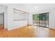 Bright living room with hardwood floors and sliding glass doors to outdoor deck at 205 Bruton Dr, Chapel Hill, NC 27516