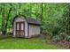 Backyard shed that offers practical storage space and complements the verdant surroundings at 205 Bruton Dr, Chapel Hill, NC 27516