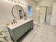 Bathroom featuring a double sink vanity with marble countertops and a glass enclosed shower at 206 Lilliput Ln, Wake Forest, NC 27587