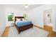Cozy bedroom with natural light and hardwood floors at 206 Lilliput Ln, Wake Forest, NC 27587