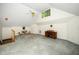 Spacious bonus room with carpeted floor, desk, ample light, and high ceilings at 206 Lilliput Ln, Wake Forest, NC 27587
