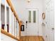 Bright foyer with hardwood floors, staircase, and a white front door with glass inserts at 206 Lilliput Ln, Wake Forest, NC 27587