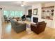 Comfortable living room featuring a fireplace, piano, and views of the outdoors at 206 Lilliput Ln, Wake Forest, NC 27587