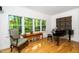 Bright living room with a piano and an exterior view at 206 Lilliput Ln, Wake Forest, NC 27587