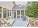 Charming back deck with screened-in porch, seating and grill, perfect for outdoor relaxation at 210 Bennington Pkwy, Durham, NC 27713
