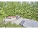 Expansive backyard offers multiple seating areas, fire pit, and lush landscaping at 210 Bennington Pkwy, Durham, NC 27713