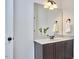 Bathroom boasts granite counters, dark wood cabinets, and decorative mirror at 210 Bennington Pkwy, Durham, NC 27713