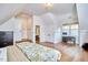 Bright bedroom features hardwood floors, a desk, and wainscoting detail at 210 Bennington Pkwy, Durham, NC 27713