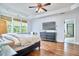 Main bedroom features beautiful windows, hard wood floors, and a tray ceiling at 210 Bennington Pkwy, Durham, NC 27713