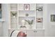 Built-in shelves filled with decorative items, plants, and artwork at 210 Bennington Pkwy, Durham, NC 27713
