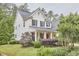 Charming two-story home with inviting front yard and well-manicured landscaping at 210 Bennington Pkwy, Durham, NC 27713