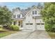 Beautiful two-story home with a well-maintained lawn and a two-car garage at 210 Bennington Pkwy, Durham, NC 27713
