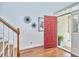 Inviting foyer with hardwood floors and bright entry, showcasing the front porch at 210 Bennington Pkwy, Durham, NC 27713