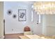 Light-filled foyer with hardwood floors, white trim, and a stylish light fixture at 210 Bennington Pkwy, Durham, NC 27713