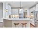 Modern kitchen showcasing stainless steel appliances, marble countertops, and sleek white cabinetry at 210 Bennington Pkwy, Durham, NC 27713