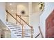 Open stairway with dark wood railings and white trim details at 210 Bennington Pkwy, Durham, NC 27713
