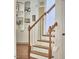 Stairway with wood handrail, white risers, and wood floors at 210 Bennington Pkwy, Durham, NC 27713