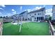 Spacious backyard featuring a pool, swing set, and well-maintained lawn at 232 Hensley Hill Pl, Holly Springs, NC 27540