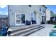 Backyard deck and patio with easy pool access, creating a seamless transition for indoor/outdoor living at 232 Hensley Hill Pl, Holly Springs, NC 27540