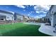 Backyard featuring artificial turf, pool, and swing set, ideal for outdoor enjoyment at 232 Hensley Hill Pl, Holly Springs, NC 27540