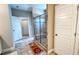 Bathroom featuring a glass-enclosed shower with tiled walls and floor with bath mat at 232 Hensley Hill Pl, Holly Springs, NC 27540