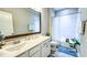 Well-lit bathroom featuring a vanity with double sinks and shower-tub combination at 232 Hensley Hill Pl, Holly Springs, NC 27540