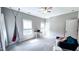 Spacious bedroom with stylish hanging chair and a cozy seating area at 232 Hensley Hill Pl, Holly Springs, NC 27540