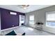 Bedroom with windows, a purple accent wall, and a stylish hanging chair at 232 Hensley Hill Pl, Holly Springs, NC 27540