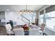 Elegant dining area with stylish furniture, modern lighting, and an inviting atmosphere for Gathering and guests at 232 Hensley Hill Pl, Holly Springs, NC 27540