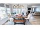 Bright dining area with a stylish table set, natural light, and views into the adjoining living spaces at 232 Hensley Hill Pl, Holly Springs, NC 27540