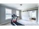 Exercise room with treadmill, natural light, and barn door for a modern touch at 232 Hensley Hill Pl, Holly Springs, NC 27540