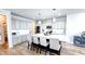 Spacious kitchen with a large island, seating, stainless appliances, and ample counter space, ideal for Gathering gatherings at 232 Hensley Hill Pl, Holly Springs, NC 27540