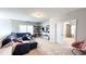 Upstairs living area with spacious sectional, lots of natural light, and an open layout at 232 Hensley Hill Pl, Holly Springs, NC 27540