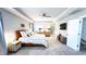 Bright main bedroom featuring carpet, a tray ceiling, night stands and lamps, and lots of space at 232 Hensley Hill Pl, Holly Springs, NC 27540