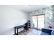 Bright office space with neutral decor, backyard pool view through sliding glass doors at 232 Hensley Hill Pl, Holly Springs, NC 27540