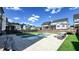 Private backyard featuring a sparkling in-ground pool, spacious patio, and manicured artificial turf for low maintenance living at 232 Hensley Hill Pl, Holly Springs, NC 27540