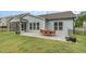 Backyard patio includes outdoor dining and entertaining area with a nice lawn at 3034 Raddercrest Ct, Fuquay Varina, NC 27526