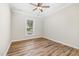Bedroom boasts wood-look flooring, a ceiling fan, and gets great natural light at 3034 Raddercrest Ct, Fuquay Varina, NC 27526