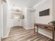 Welcoming foyer featuring wood-look floors and elegant wall paneling at 3034 Raddercrest Ct, Fuquay Varina, NC 27526