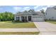 Charming single-story home featuring a well-manicured lawn and attached two car garage at 3034 Raddercrest Ct, Fuquay Varina, NC 27526