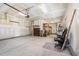 Spacious garage with storage shelving, an automatic door, and concrete flooring at 3034 Raddercrest Ct, Fuquay Varina, NC 27526